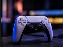 Close-up of a gaming controller in hand